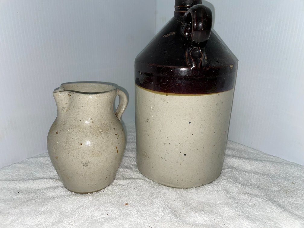 Cream and brown jug, cream colored pitcher with applied handle