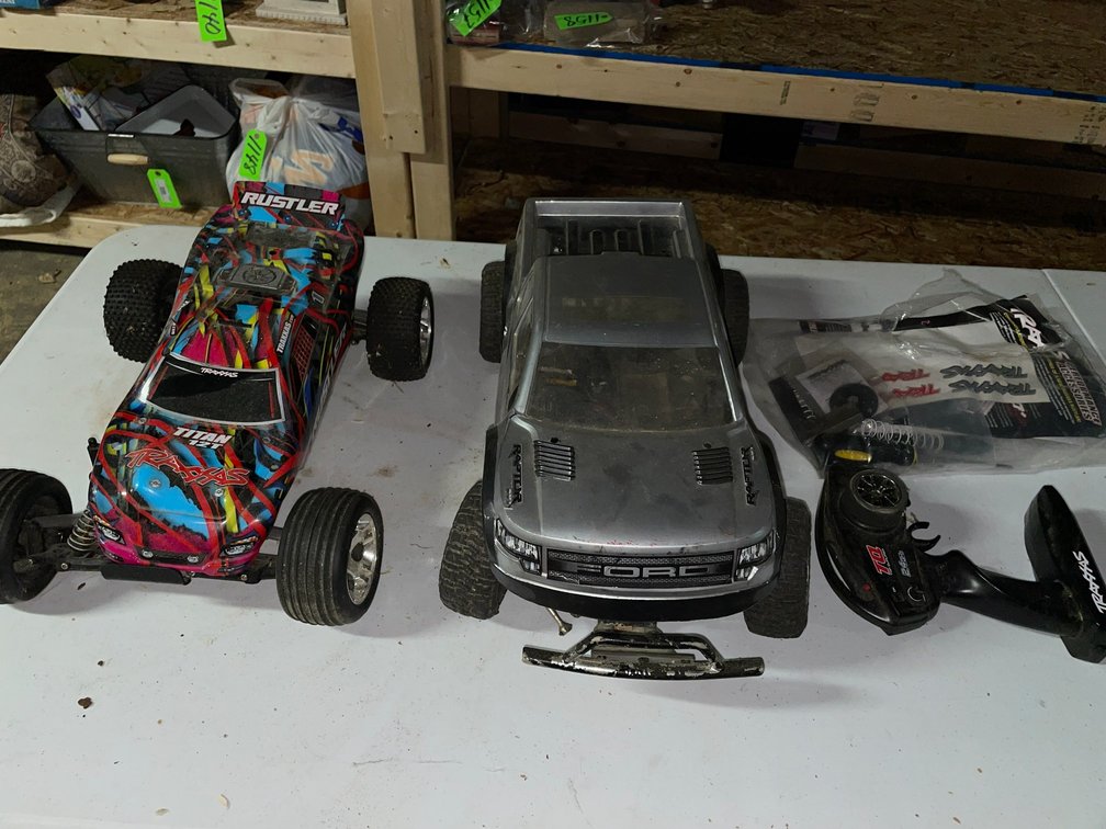 2 Traxxxs 1/10 scale RC trucks, brushed motors, speed control-no batteries, 1 radio and some spare parts