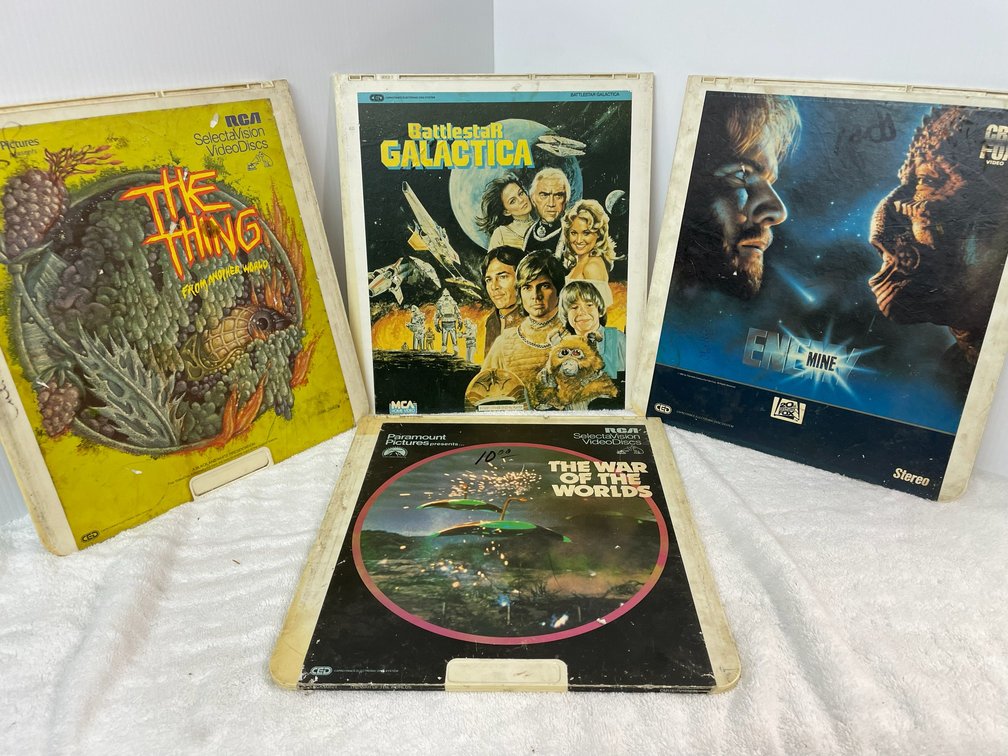 Selection of Select Division video disc movies-War of the Worlds, The Thing From Another Planet, Enemy of Mine, Battlestar Galactica