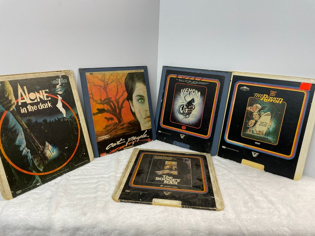 Selection of video discs-Alone in the Dark, Cat People, The Boogie Man, Venom, The Raven