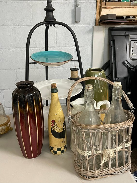 Vases, cream pitcher,  basket with bottles