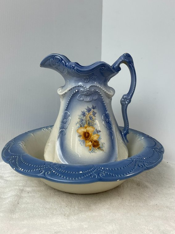 Blue and white pitcher and bowl with floral detail