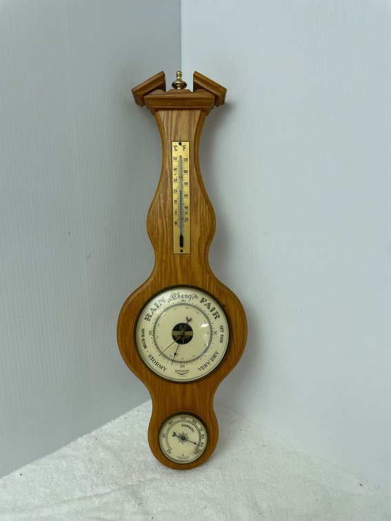 Barometer with wooden base and thermometer