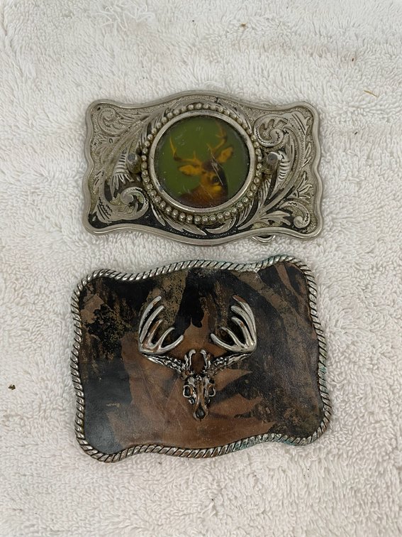 2 Belt buckles-1 with raised buck, 1 with picture of a buck