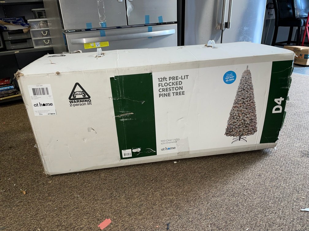 12' Pre-lit flocked Creston pine tree