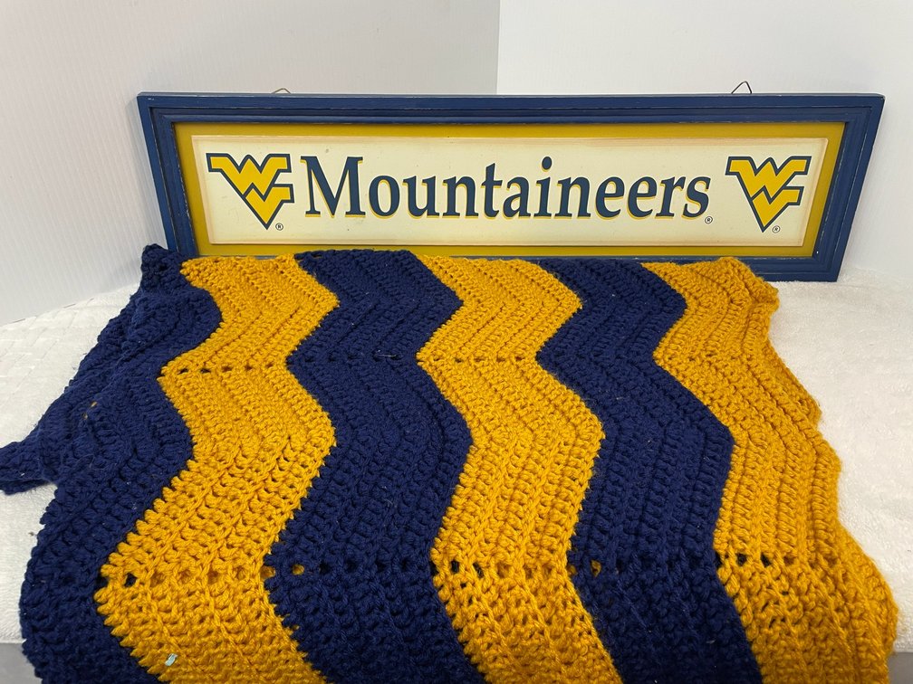 Mountaineers wall sign, blue and gold afghan
