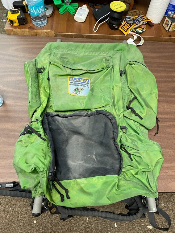 Metal frame Back Country hiking backpack with a Bass Angler Society patch stitched on it