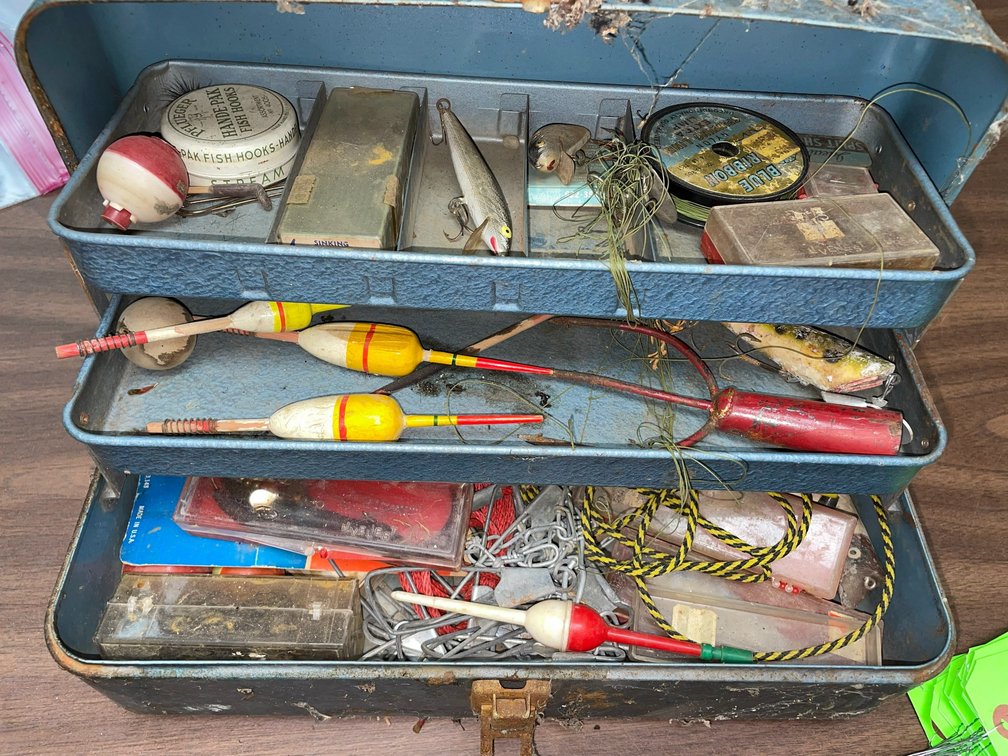 Collection of wooden bobbers and other fishing items