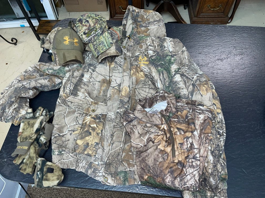Carhartt Realtree camouflage jacket size 3X, size 2X Carhartt shirt, various Realtree and other  camouflage hats including Mossy Oak, etc.