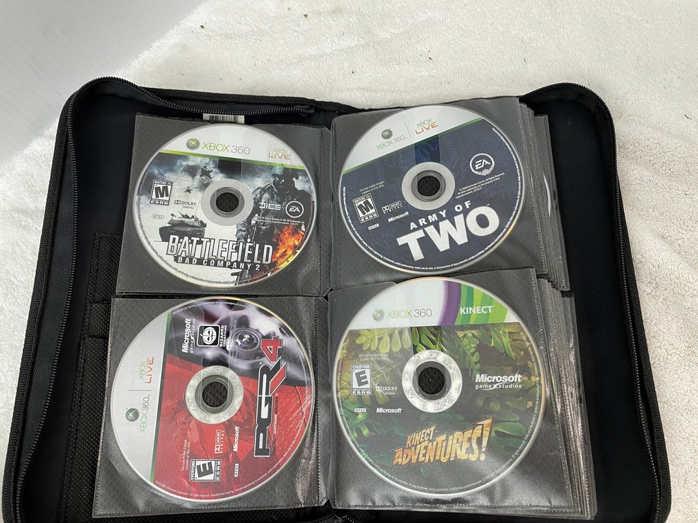Large selection of Xbox 360 games in zipper pouch**no cases**