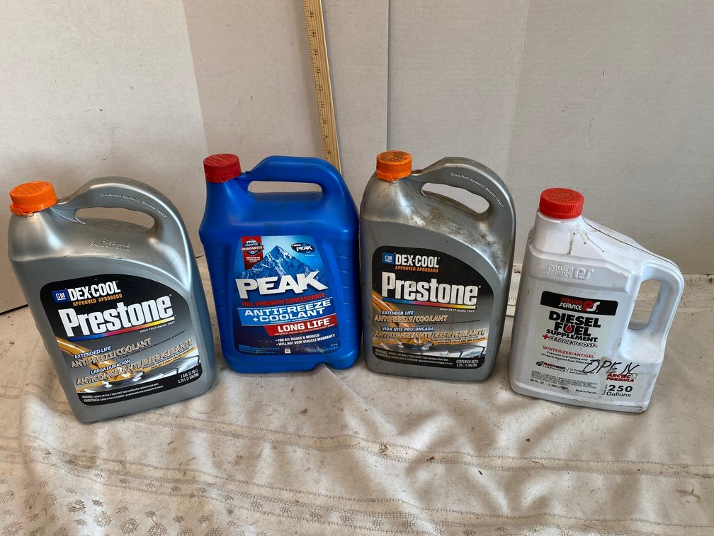 1-Prestone Antifreeze Jug (Sealed), 2-Partial Jugs, 1-Partial Jug Diesel Fuel Treatment