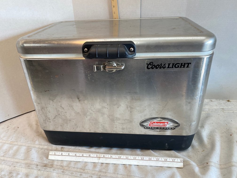 Coleman Steel Cooler with Coors light Sticker on it