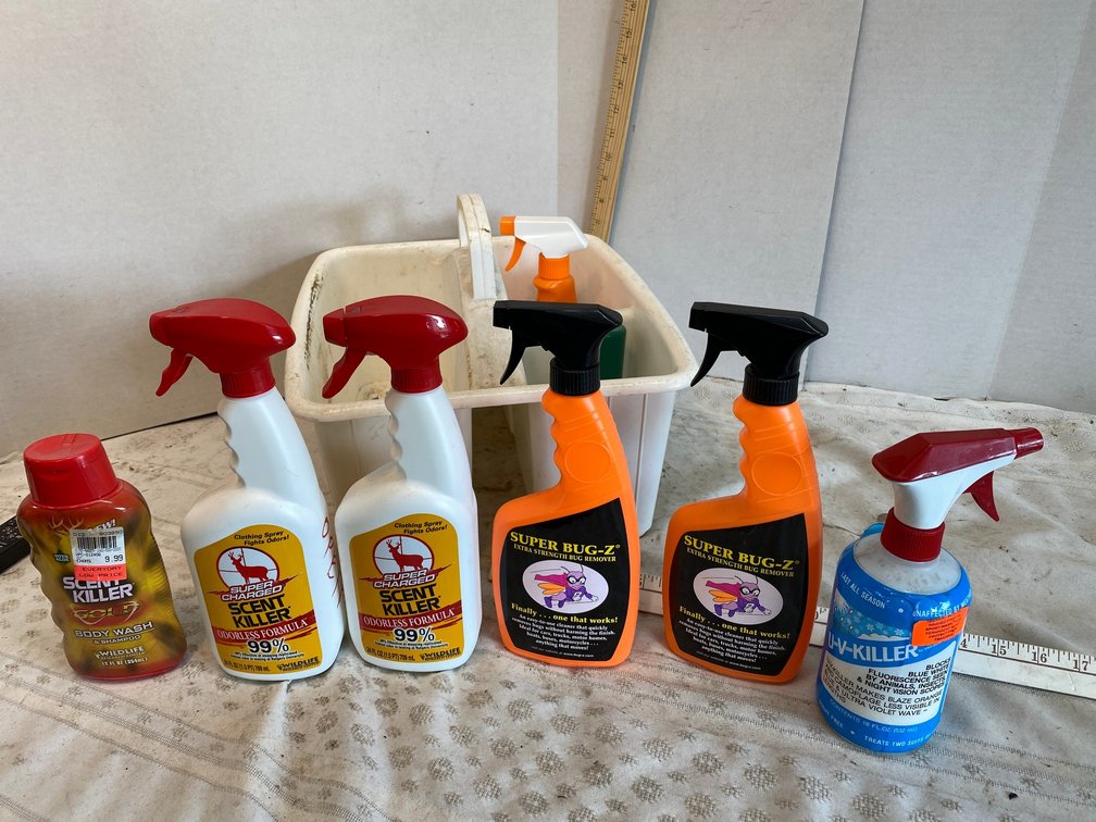 Cleaning bucket with Hunters Scent Killer Sprays, Super Bugsy Bug Remover Scent Killer Body Wash and Shampoo