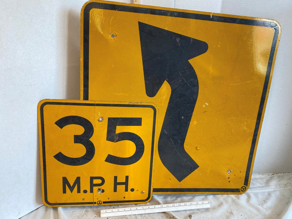Road Sign for Curving Road Ahead, 35 Miles Per Hour