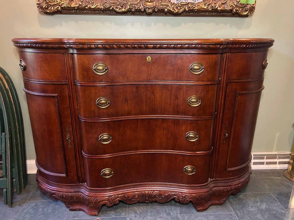 Serpentine front buffet with marble inserts