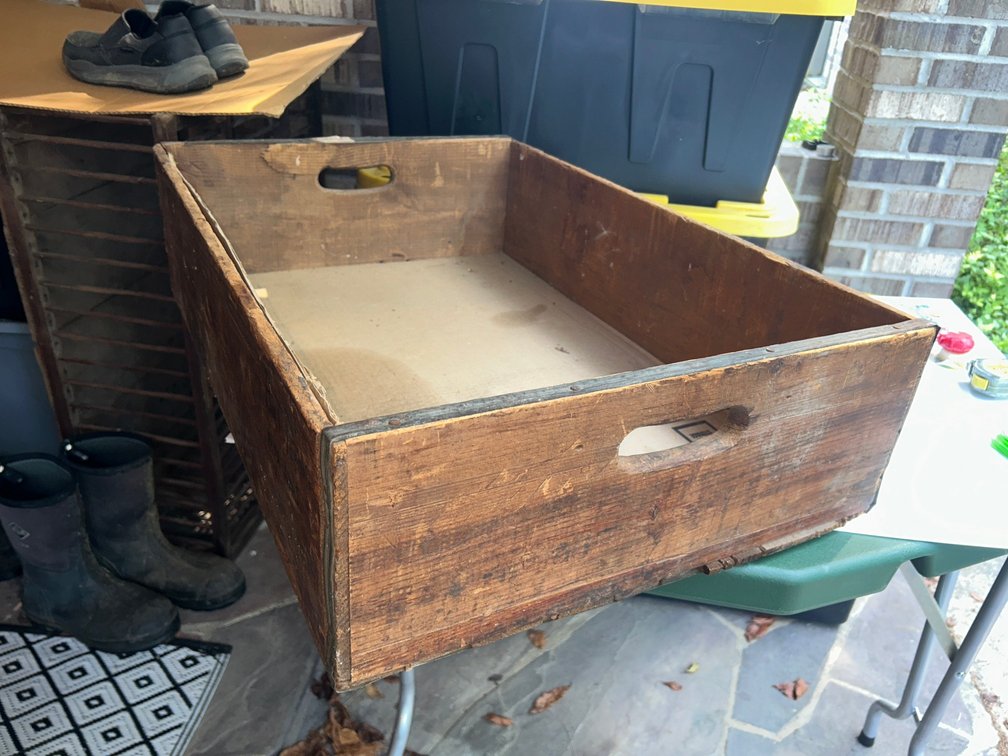 Wooden crate with metal strap reinforcements