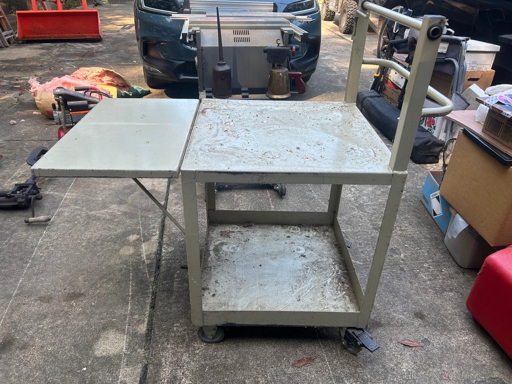 Metal rolling cart with collapsible leaf