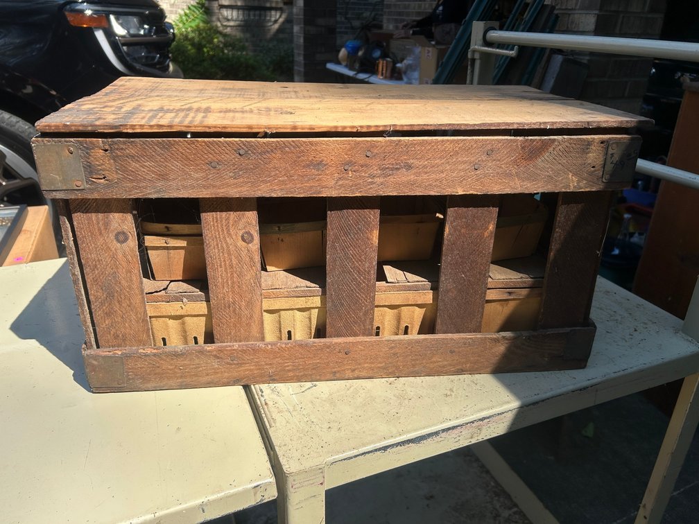 Vintage wooden crate with berry baskets