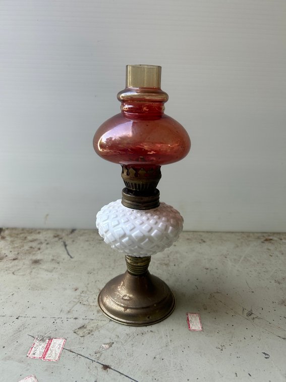 Milkglass base oil lamp with ruby globe