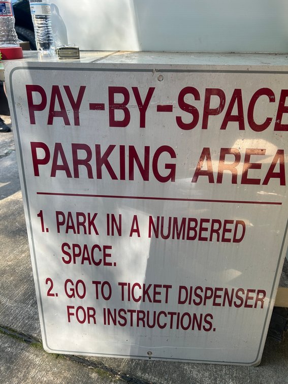 Pay By Space parking area sign