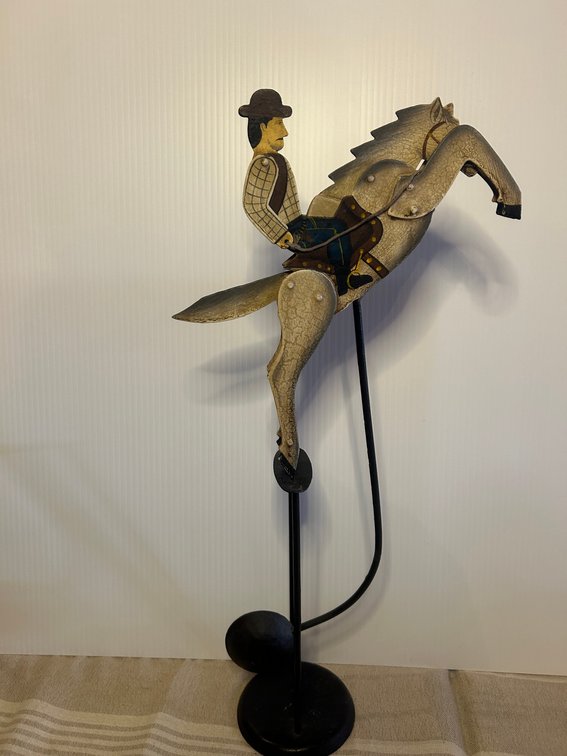 Folk art balancing statue