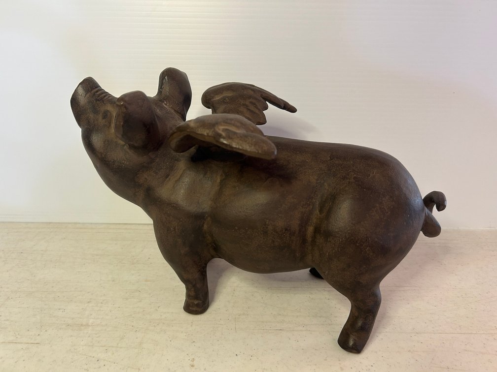 Cast iron pig with wings