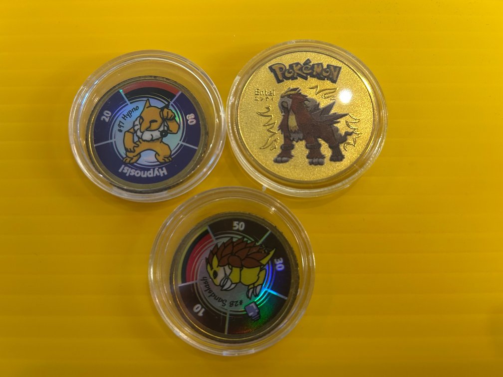 3 Pokemon collector coins