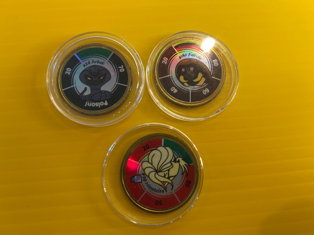 3 Pokemon collector coins