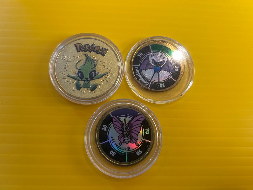 3 Pokemon collector coins
