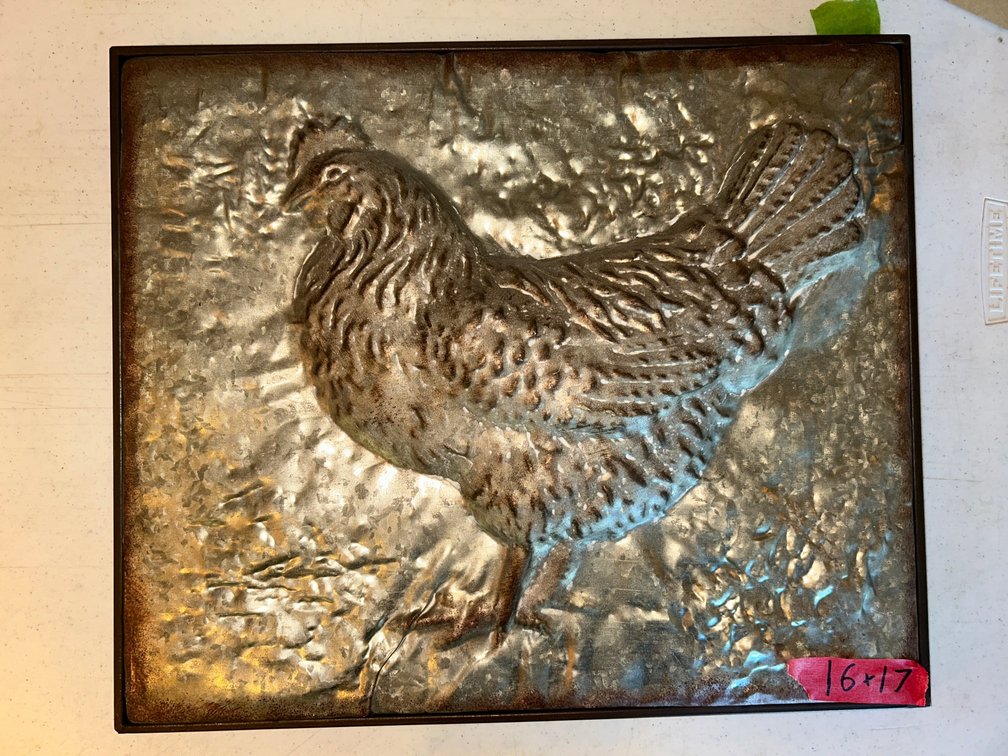 Raised relief of chicken art metal in frame