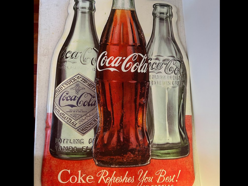 Metal Coca-Cola advertising sign