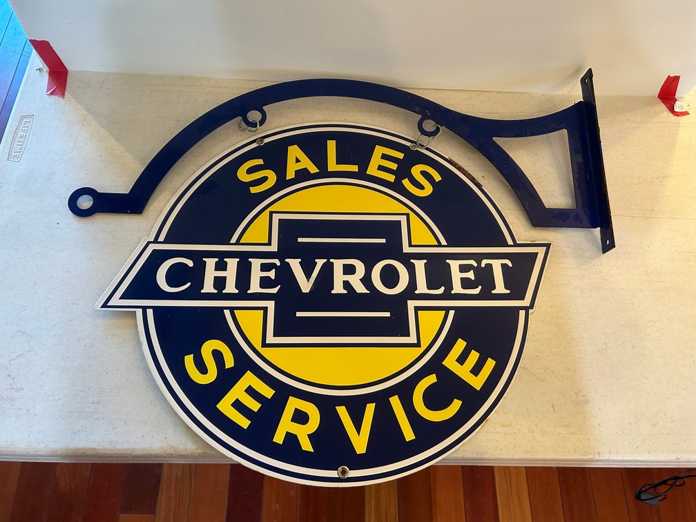 Chevrolet Sales and Service advertising sign with hanger