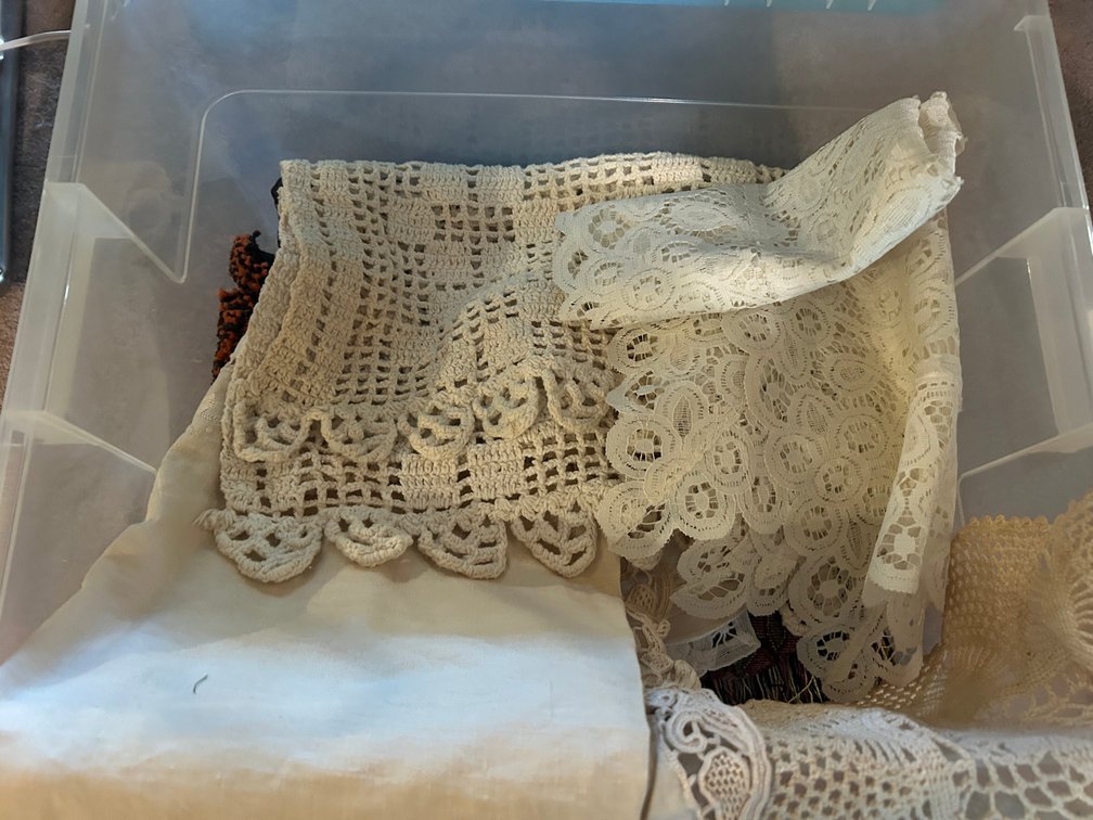 Tote of dry goods-doilies, table runners