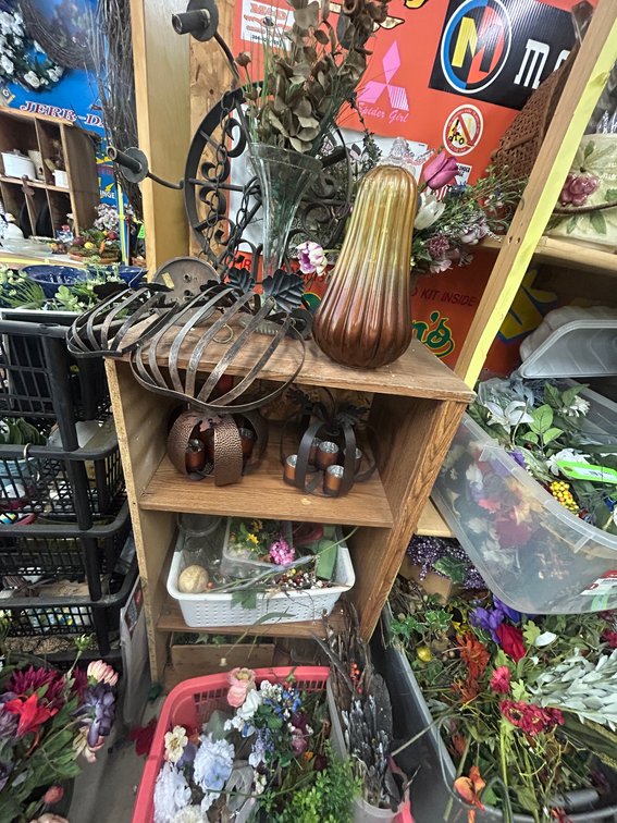 Wooden shelving unit with fall decorative items