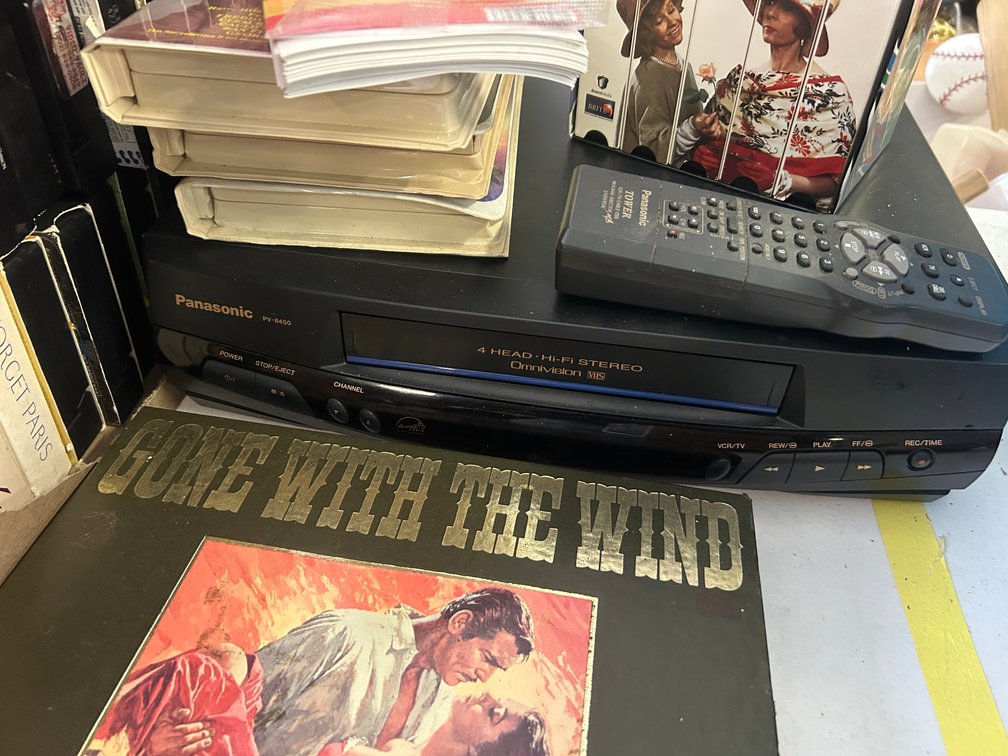 Panasonic VCR and assorted VHS tapes