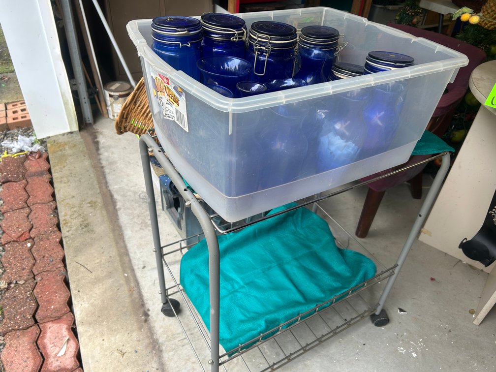 Collection of blue glass Mason jars, vases