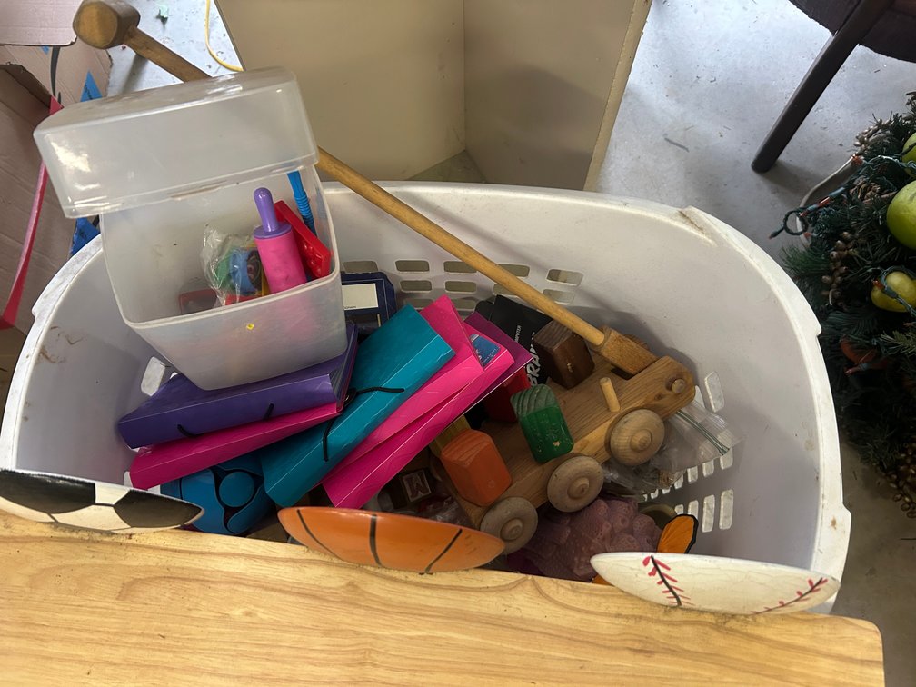Laundry basket full of kids toys