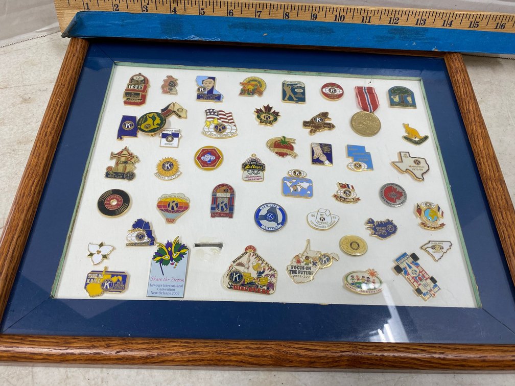 Framed Collection of Kiwanis Pins from Many States