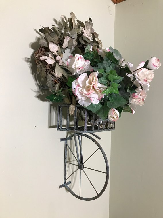 Bicycle shaped hanging flower holder with wreath