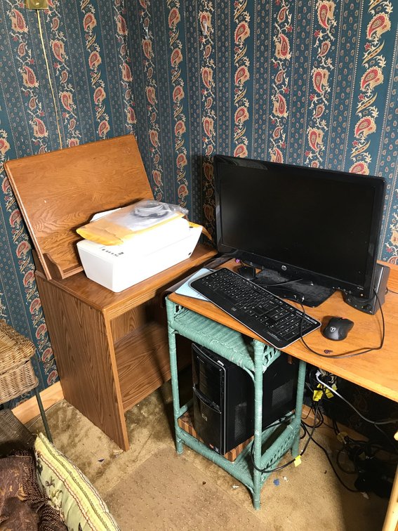 HP computer with monitor, keyboard, mouse,HP Desk Jet 2542 printer, small wicker stand, computer stand