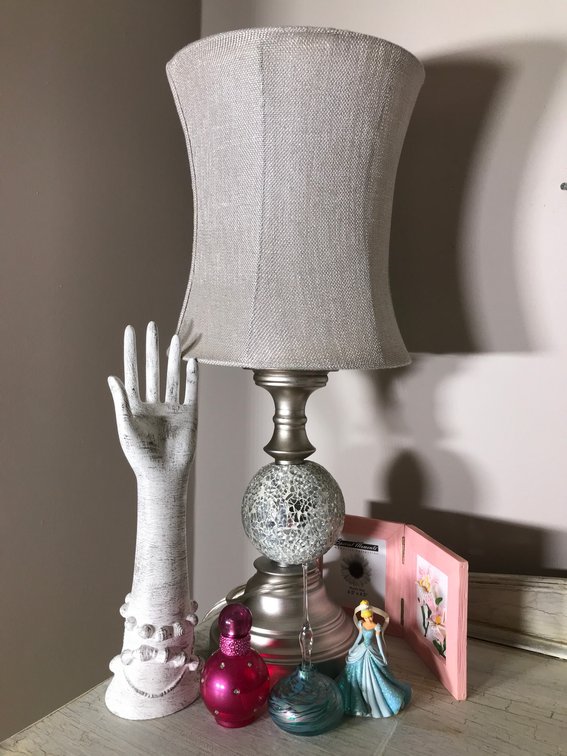 Electric lamp, glass bottles with stoppers, hand ring holder, necklace holder, misc.