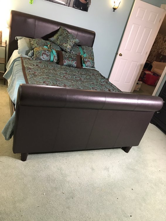 Full size bed with blankets and pillows