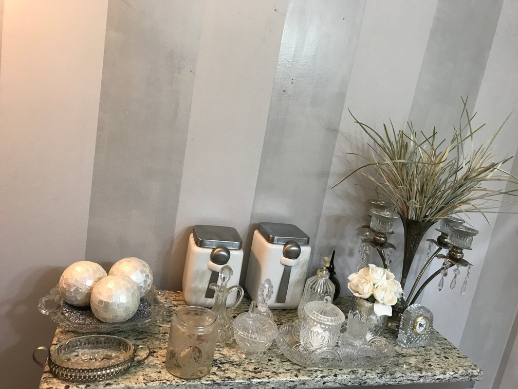 Glass and crystal dishes, mirrored orbs, candleholder with vase, etc.