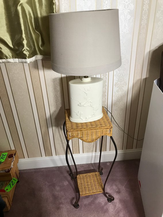 Metal and wicker stand with electric lamp