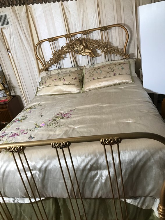 Full size metal bed with Cherub headboard
