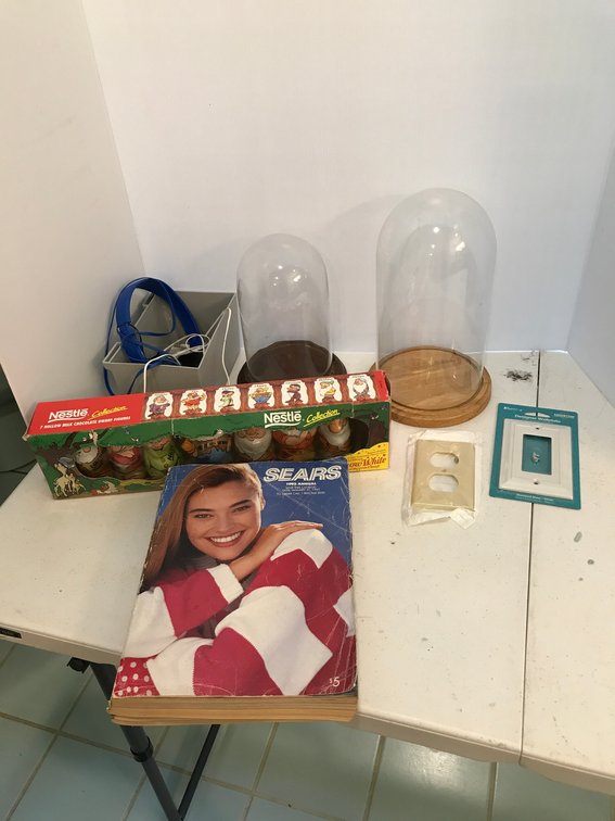 Vintage Sears catalog, glass domed display pieces, headphones, etc.