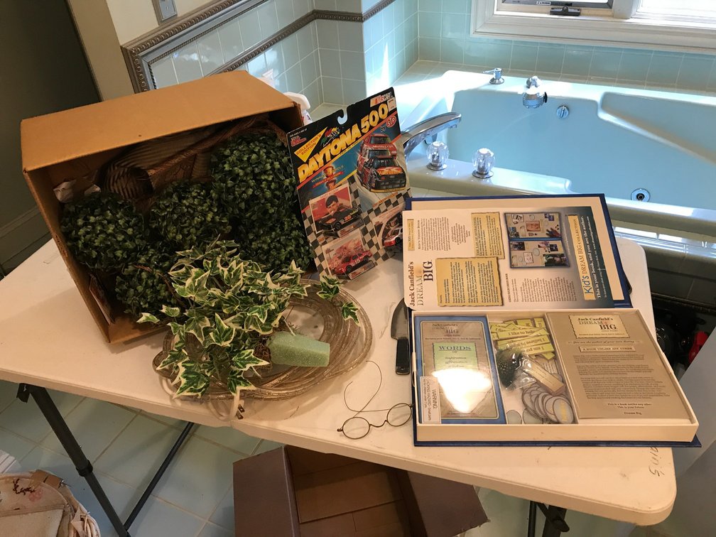Daytona 500 toy cars, religious book, other decorative items