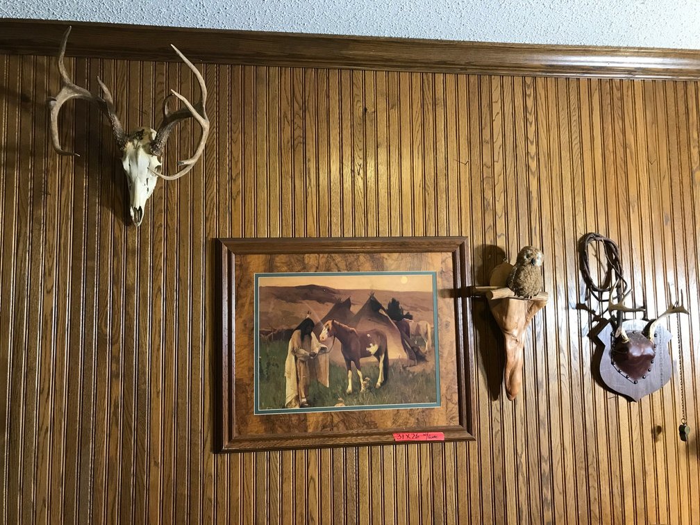 Framed Native America wall hanging-approx. 31" x 26", deer horns, whistle, etc.