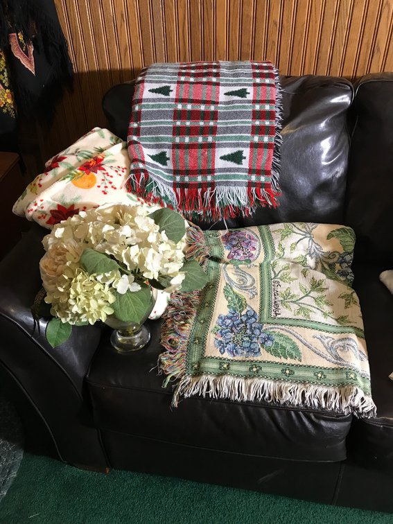 Blankets, glass vase, floral arrangements