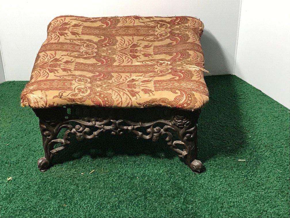 Cast iron and cloth ottomon or foot stool